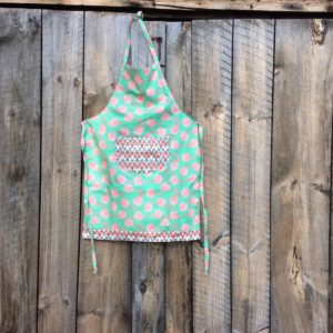 adult apron, green fabric with pink roses, stylized flower pocket