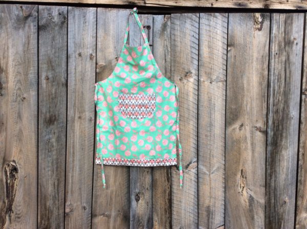 adult apron, green fabric with pink roses, stylized flower pocket
