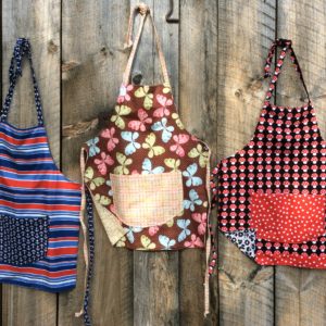 3 child aprons, stripes, butterflies, mushrooms