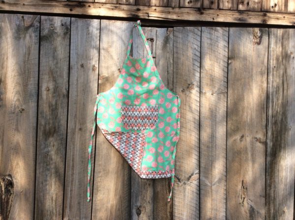 adult apron, green fabric with pink roses, stylized flower fabric pocket & reverse