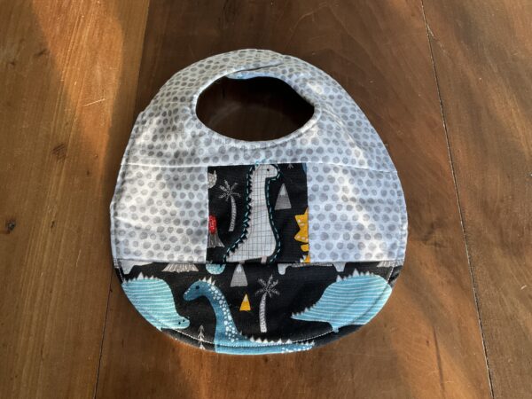 grey dinosaur dinosaur quilted baby bib