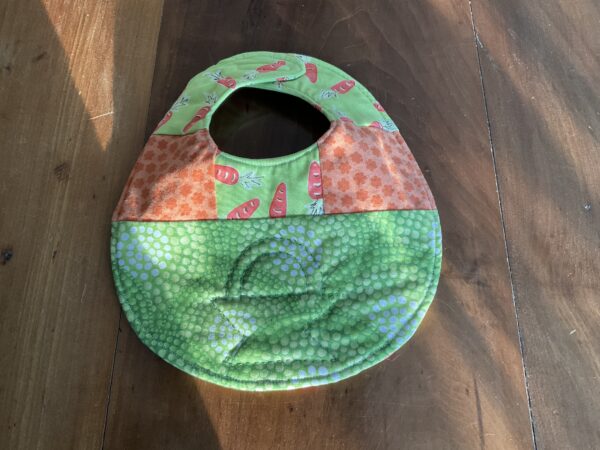 green carrot basket quilted baby bib