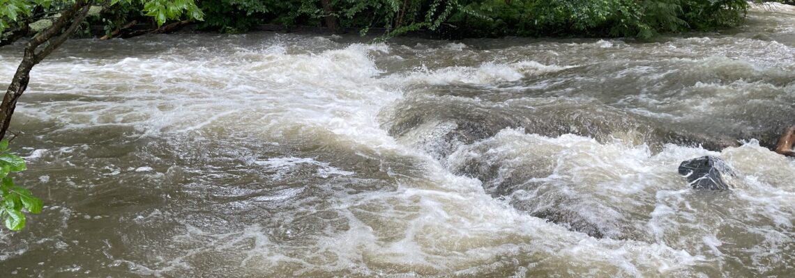 flat rock under a raging stream