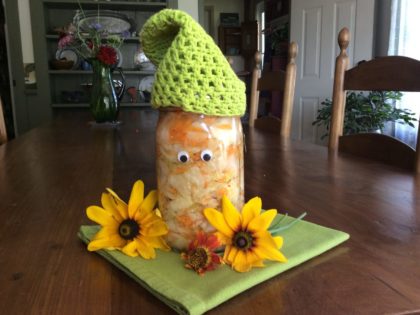 jar of Kimchi with face, flowers green hat