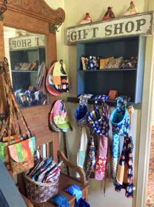 inn gift shop, apron, bags, bib potholders, coasters, hooks