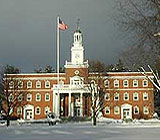 brick building, American flag, snow